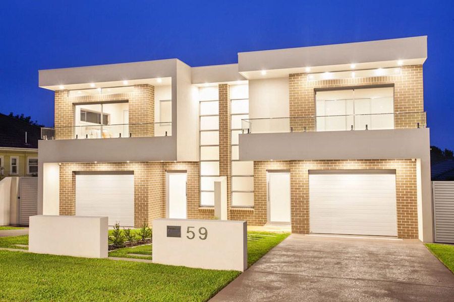 Rendered and brick duplex facade at night